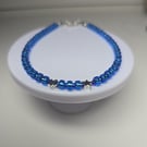 Light blue seed beaded bracelet with silver stars