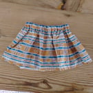 Baby skirt handmade in mustard and blue abstract pattern fabric aged 6-9 months