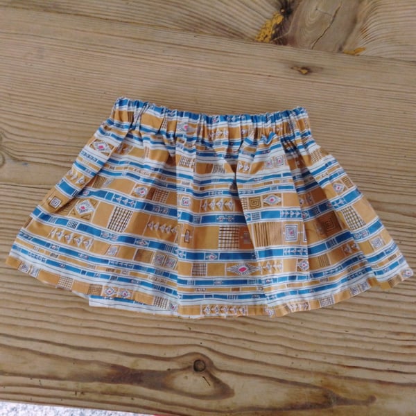 Baby skirt handmade in mustard and blue abstract pattern fabric aged 6-9 months