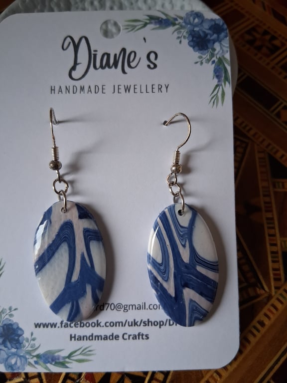 Oval blue and white earrings