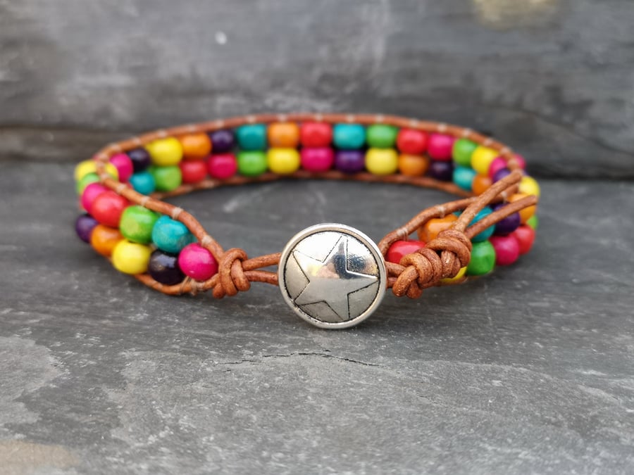 Leather bracelet with rainbow wooden beads and star button fastener, Pride