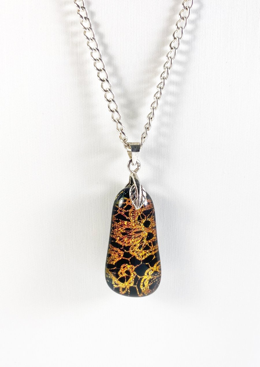 Dichroic lace etched kiln fired fused glass pendant