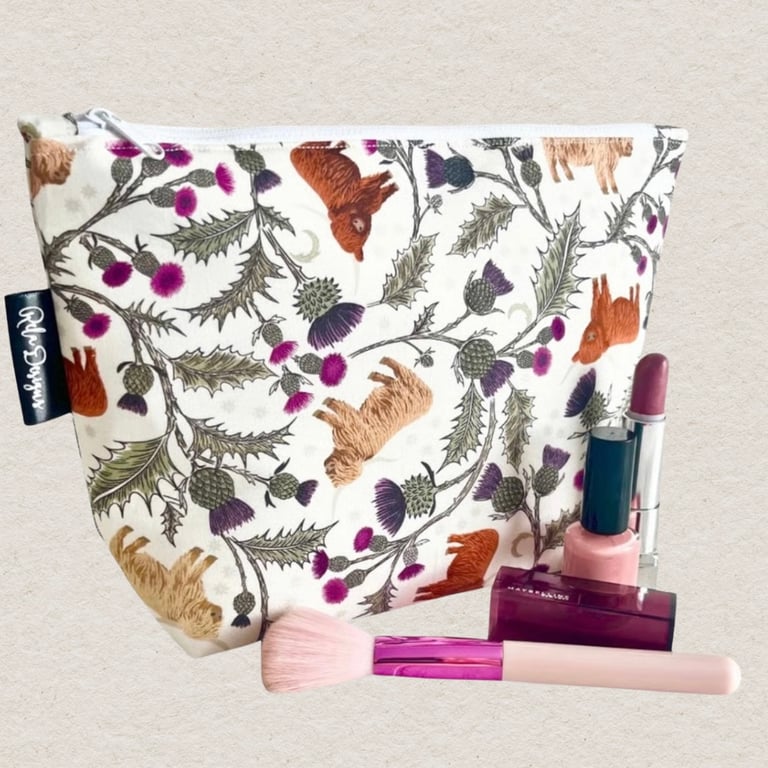 Makeup bags highland cows and thistles