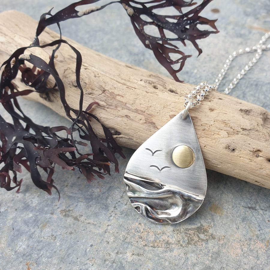 Silver beach, sea coast pendant, with brass sun and seagulls