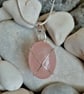 Wire-wrapped rose quartz tumble stone