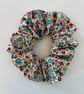 Cotton scrunchie hair accessory in a colourful floral print