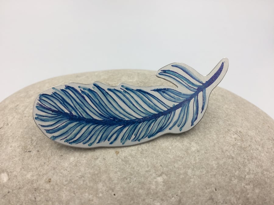 Hand printed and painted aluminium blue feather brooch 