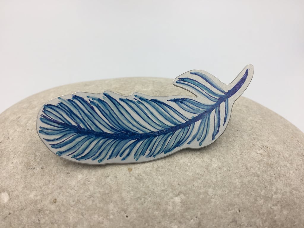 Hand printed and painted aluminium blue feather brooch 