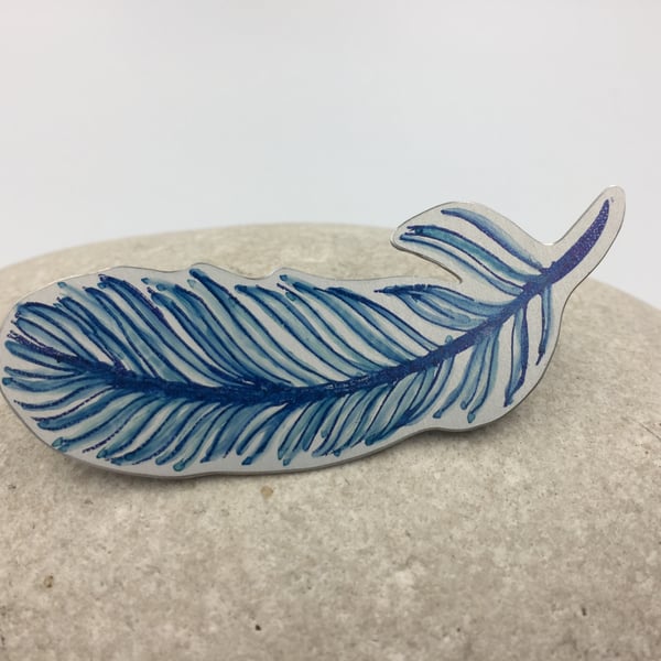 Hand printed and painted anodised aluminium blue feather brooch 