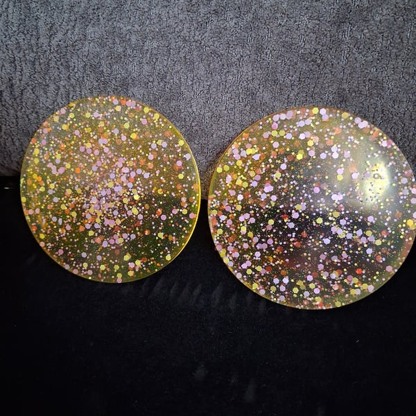 Set of two handmade epoxy resin coasters. Yellow with glitter mix 