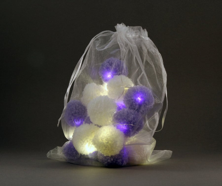 20 pom-pomfairy lights in white and lilac .