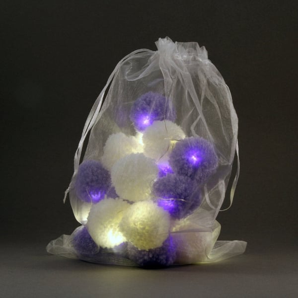 20 pom-pomfairy lights in white and lilac .