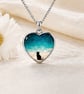 In loving memory pendant laid  with ashes 