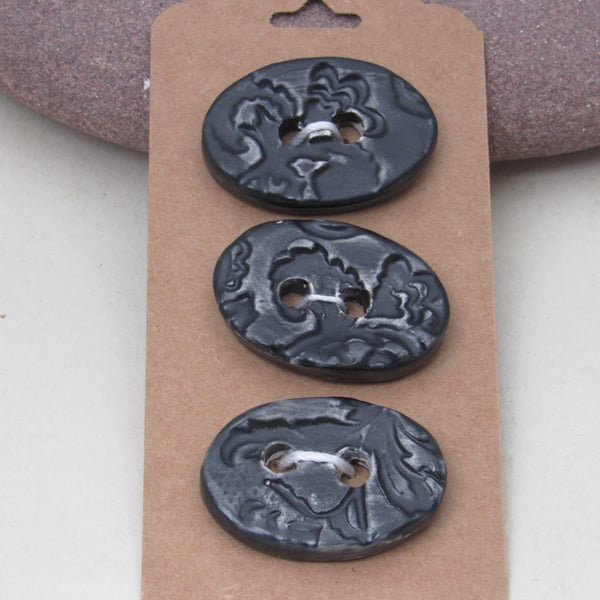 3 Medium Oval Coal Black Brocade Pattern Ceramic Buttons