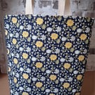 COLOURFUL FLOWERED TOTE ON NAVY BACKGROUND