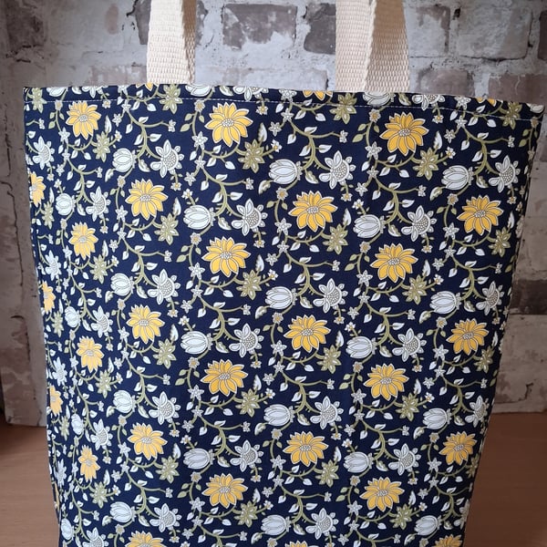 COLOURFUL FLOWERED TOTE ON NAVY BACKGROUND