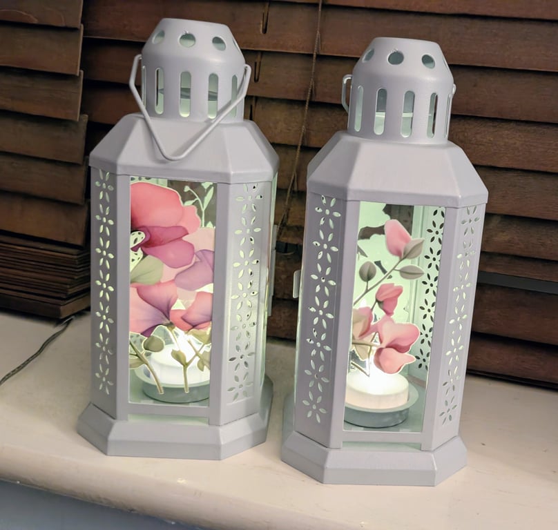 Set of two grey metal lanterns sweet peas themed with led tea light candle 