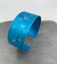 Turquoise ginkgo aluminium cuff.