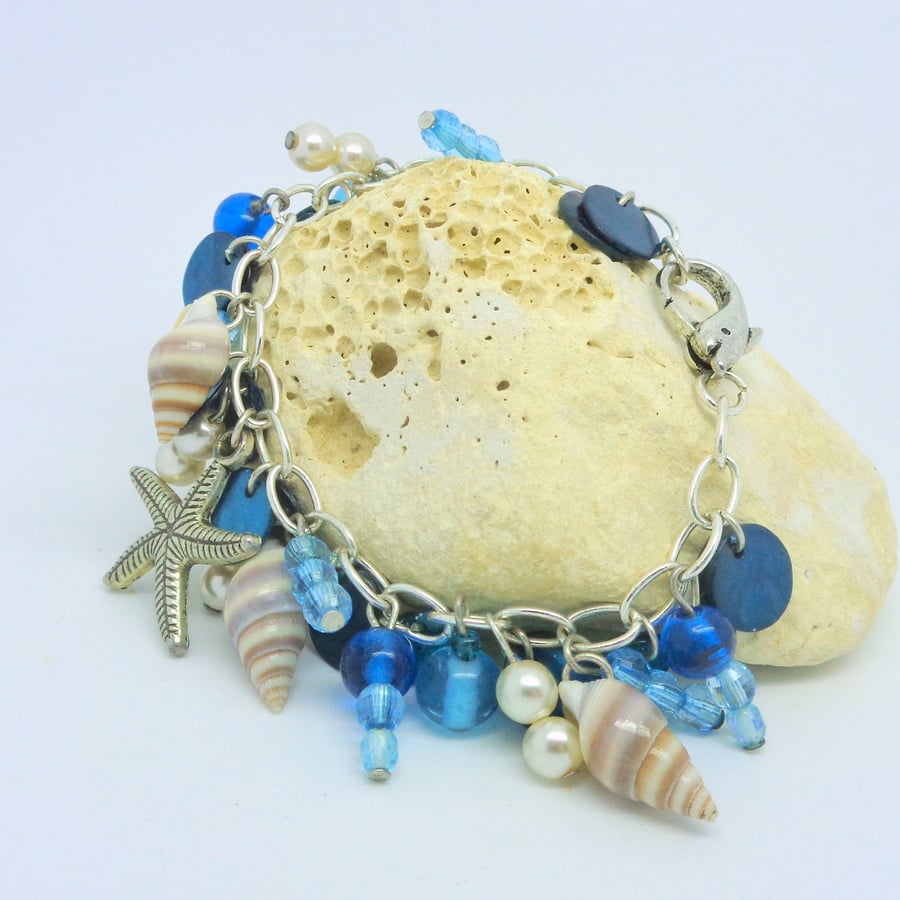Charm bracelet with shells, sea theme & dolphin clasp
