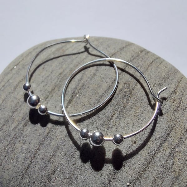 Hoop earrings with sterling silver beads