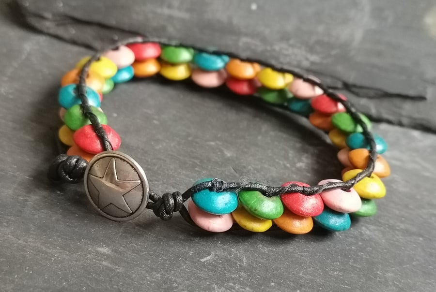 Black leather bracelet with rainbow coloured wooden beads and silver button 