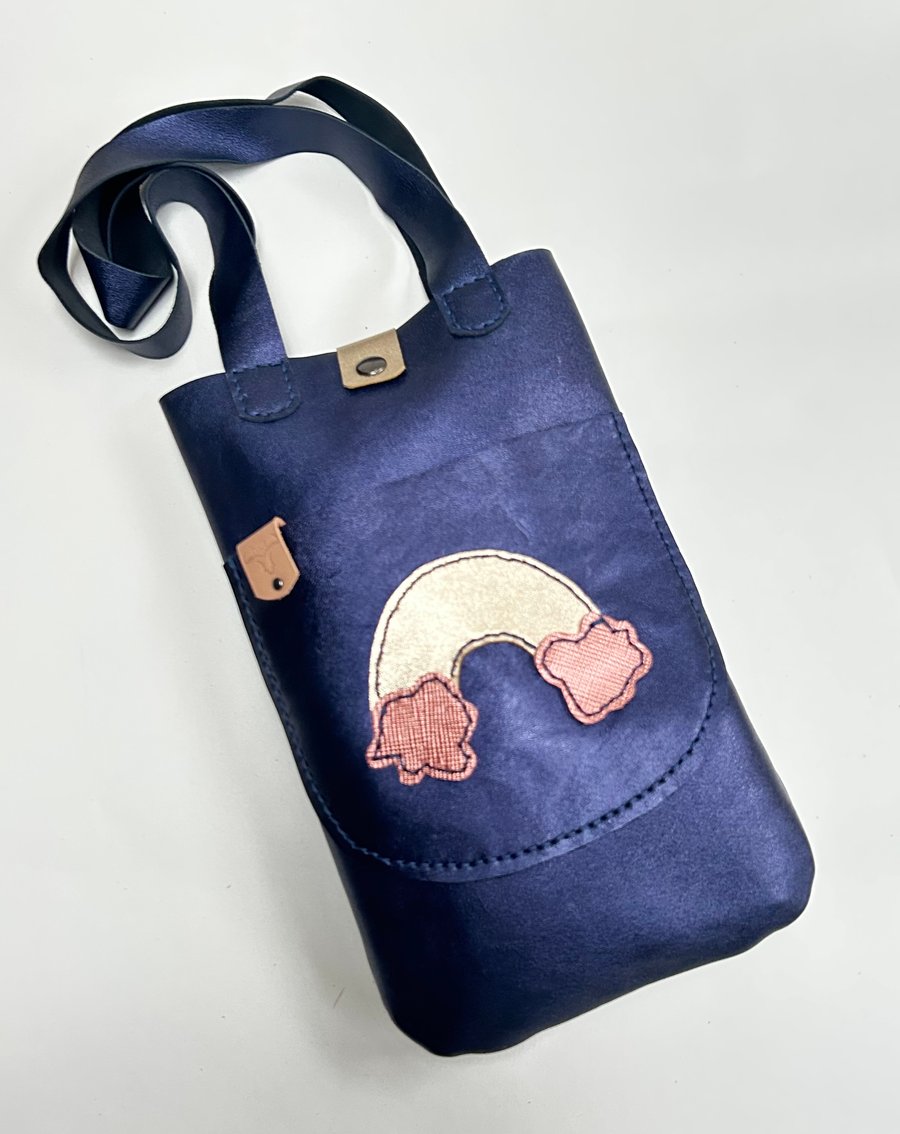Metallic blue leather tote bag with rainbow