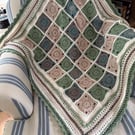 Crocheted lap blanket in autumn colours