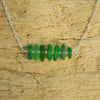 Green beach glass pendant with pink beads