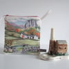 Make up bag or pouch, in vintage cross stitch with a countryside illustration.