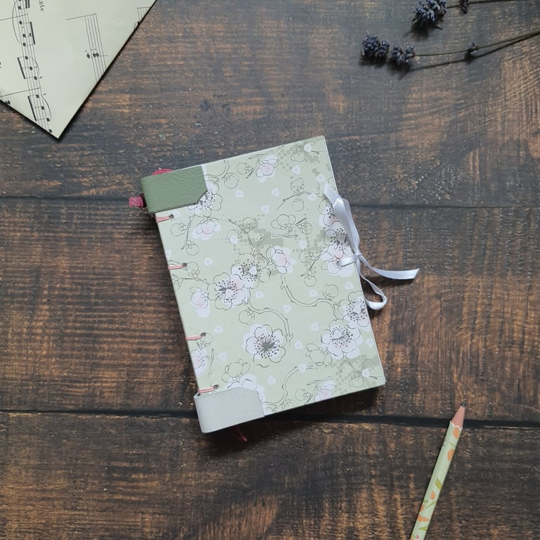 Handmade floral A6 journal, with Coptic stitching and leather detail