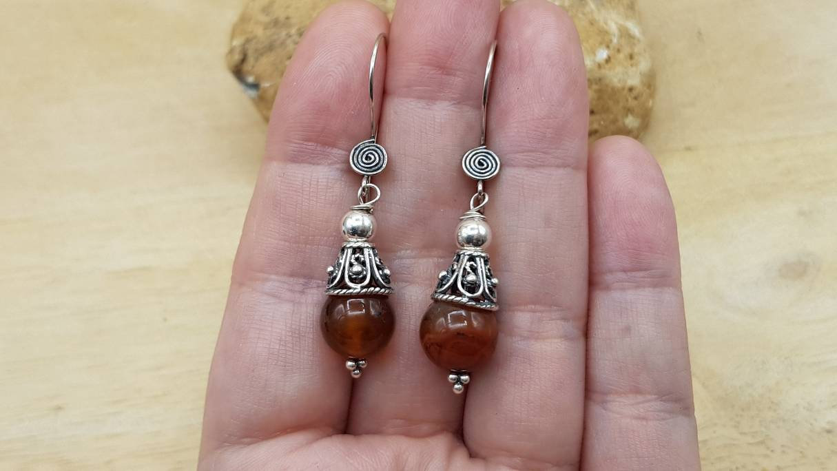 Red black Sardonyx cone earrings. Reiki jewelry uk. August birthstone