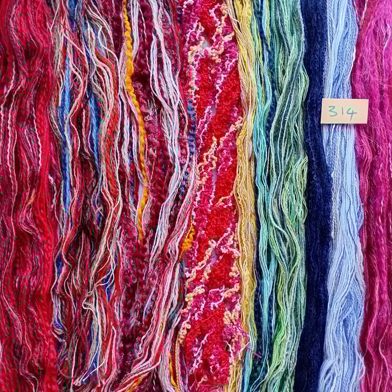 Tapestry, embroidery, weaving, tassel making threads, yarns and fibres. 