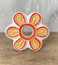 Intricate ceramic flower decoration orange - Image 1