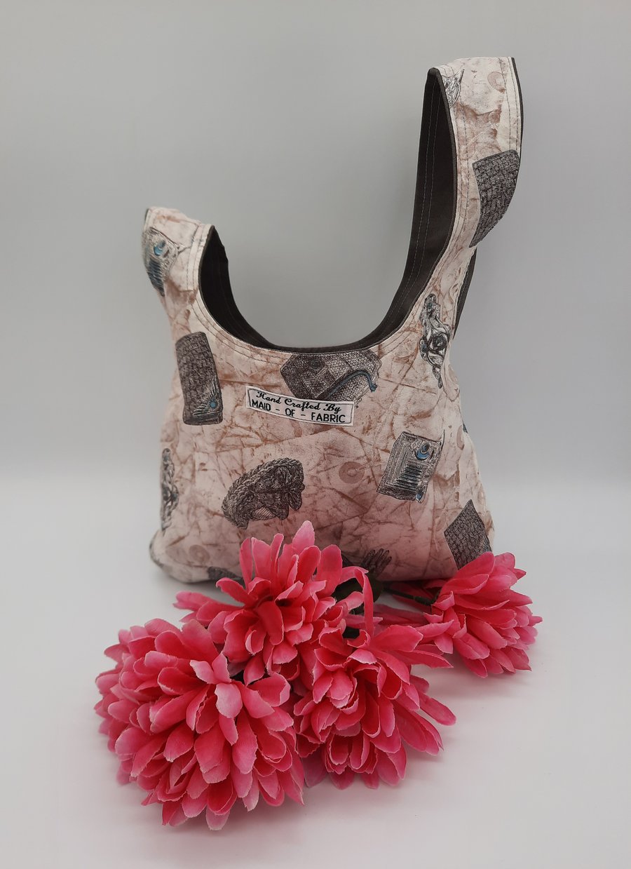  Knot bag,  small, reversible in grey denim and madam print fabric 