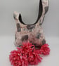  Knot bag,  small, reversible in grey denim and madam print fabric 