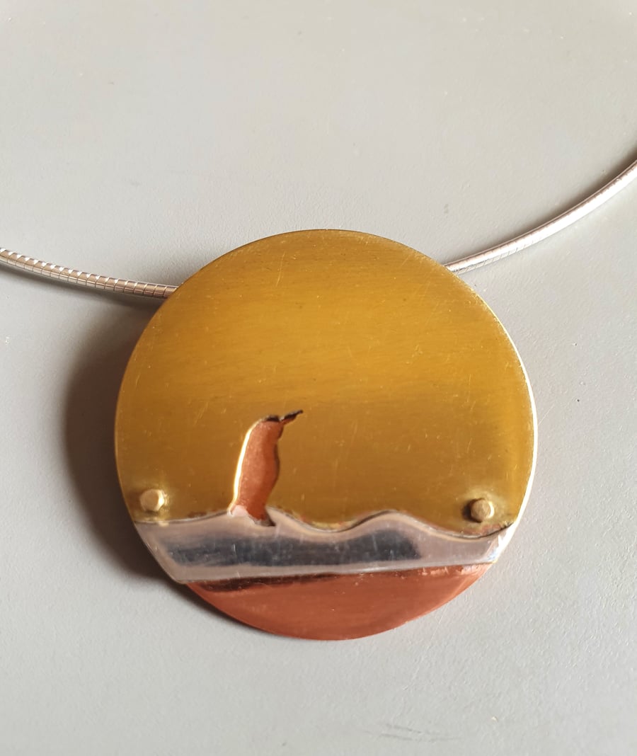 Brass and copper pendant - Penguin on ice 