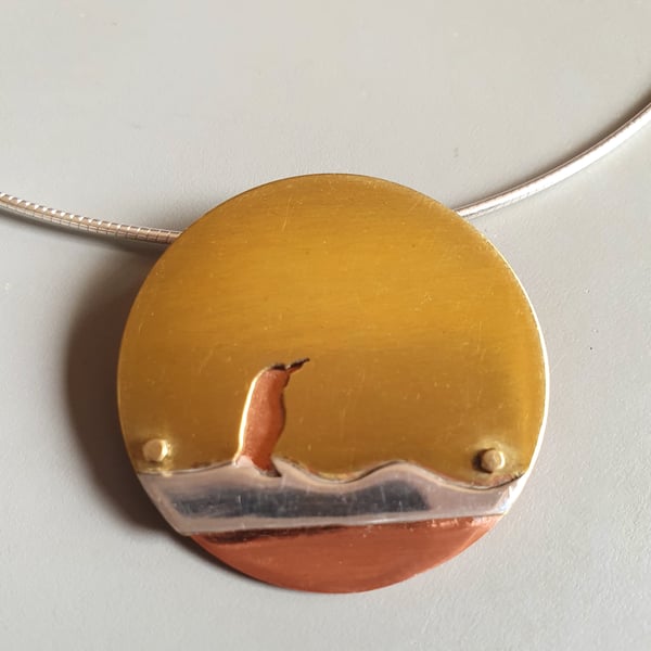 Brass and copper pendant - Penguin on ice 