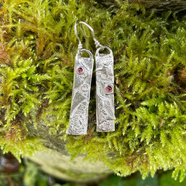 Silver and garnet mismatched earrings