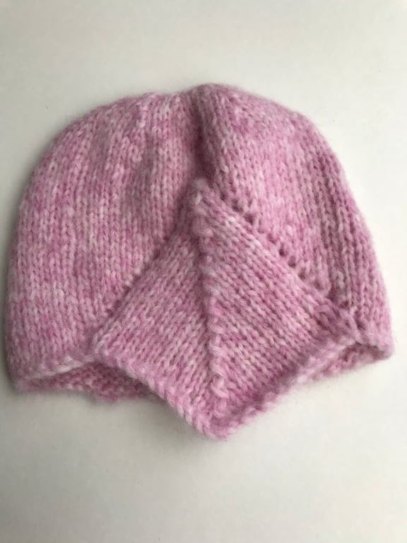 Pretty pink baby hat with peak