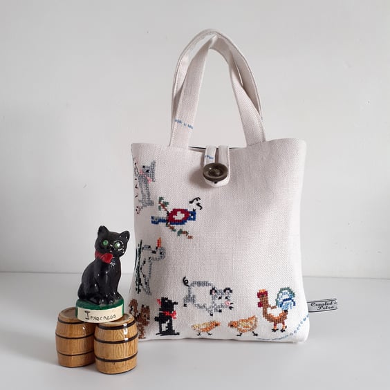 Bucket bag upcycled from vintage embroidered table linen with farmyard animals.