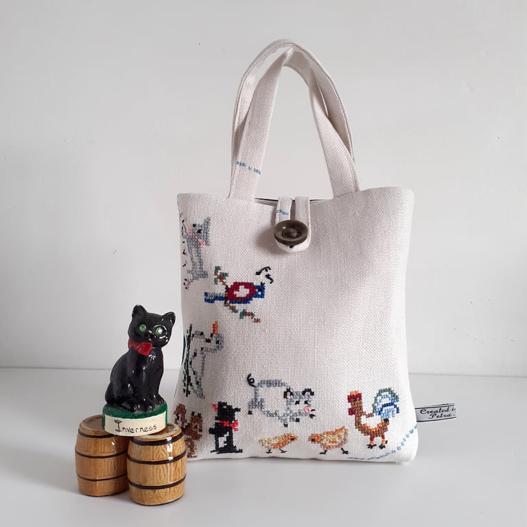 Bucket bag upcycled from vintage embroidered table linen with farmyard animals.