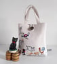 Bucket bag upcycled from vintage embroidered table linen with farmyard animals.