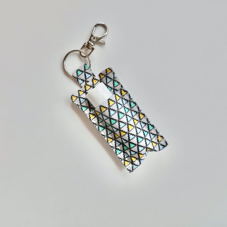 Key ring lip balm holder in grey geometric fabric