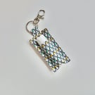Key ring lip balm holder in grey geometric fabric