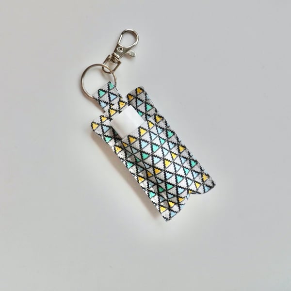 Key ring lip balm holder in grey geometric fabric