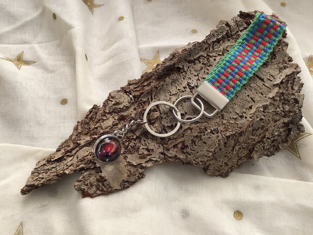 Hand woven key fob with a planetary "Nebula" embellishment orb