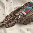 Hand woven key fob with a planetary "Nebula" embellishment orb