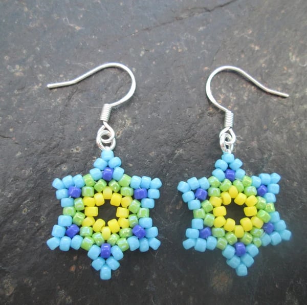 Green, blue and yellow Huichol inspired star flower beaded dangle earrings
