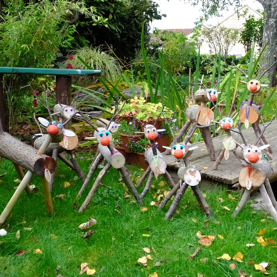 Wooden reindeer decoration to go in garden or patio at Christmas Xmas time.