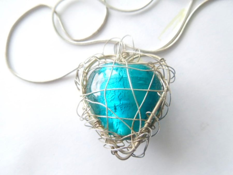 Murano glass turquoise green heart pendant with sterling silver.